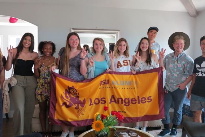 Future ASU Sun Devils learning how to throw up their pitchforks at the Los Angeles Sun Devil Send Off event. 