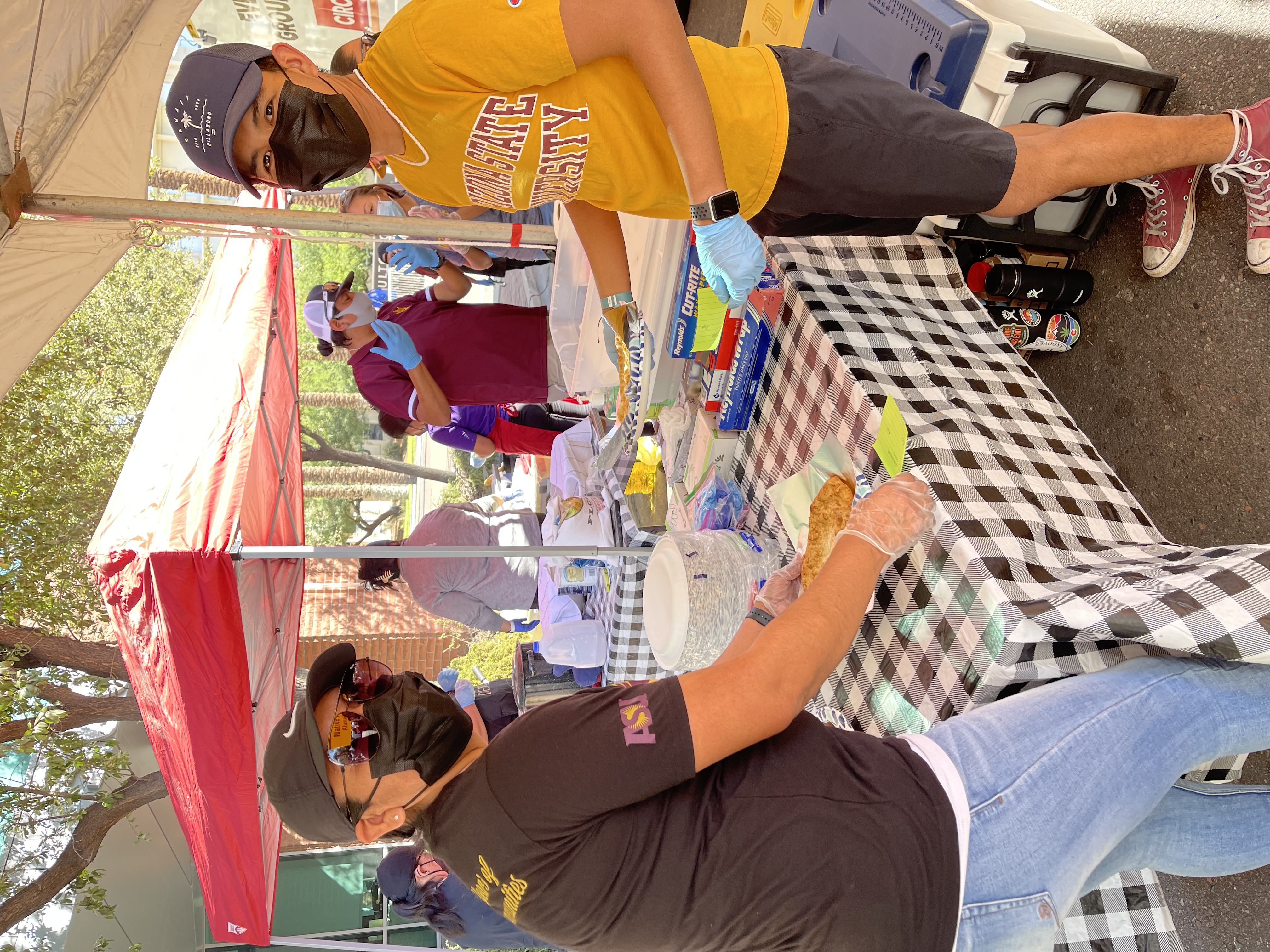 ASU students volunteering at the Frybread booth.