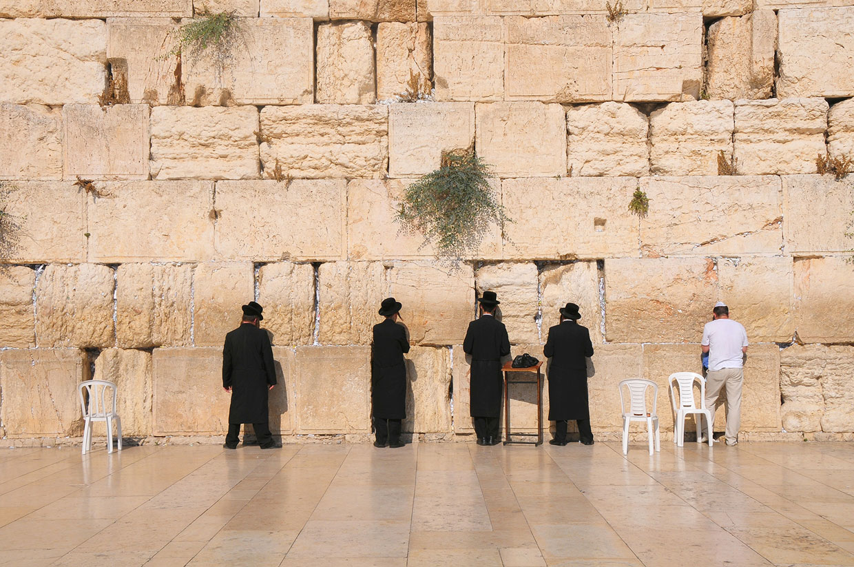 Men Praying at the Wailing Wall in Jeruslem