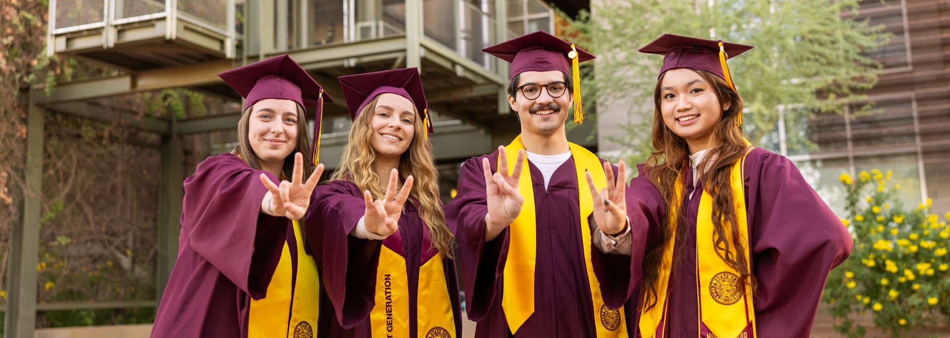 ASU students at graduation celebrating together
