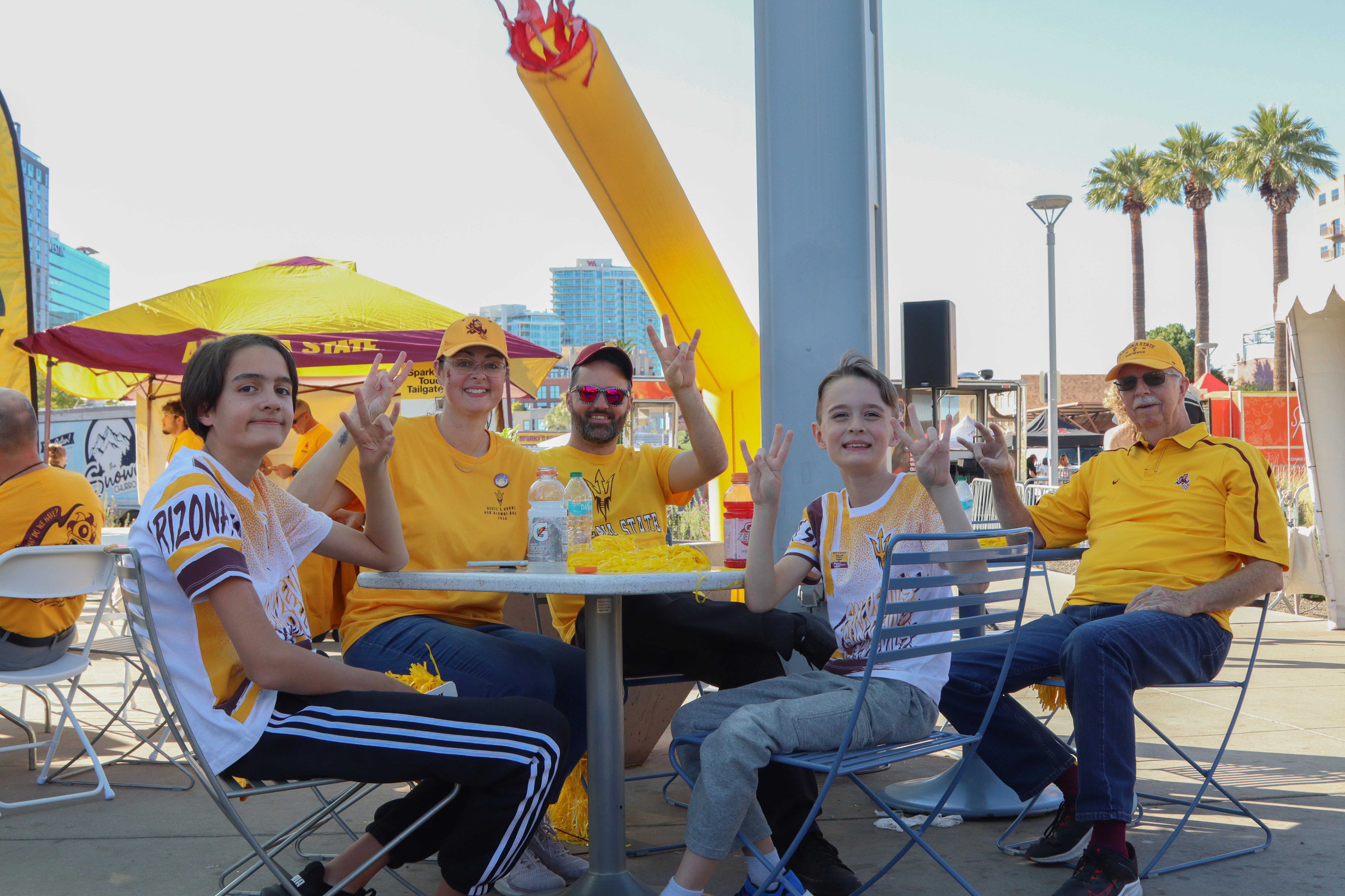 A group of people at Sparky's Touchdown Tailgate